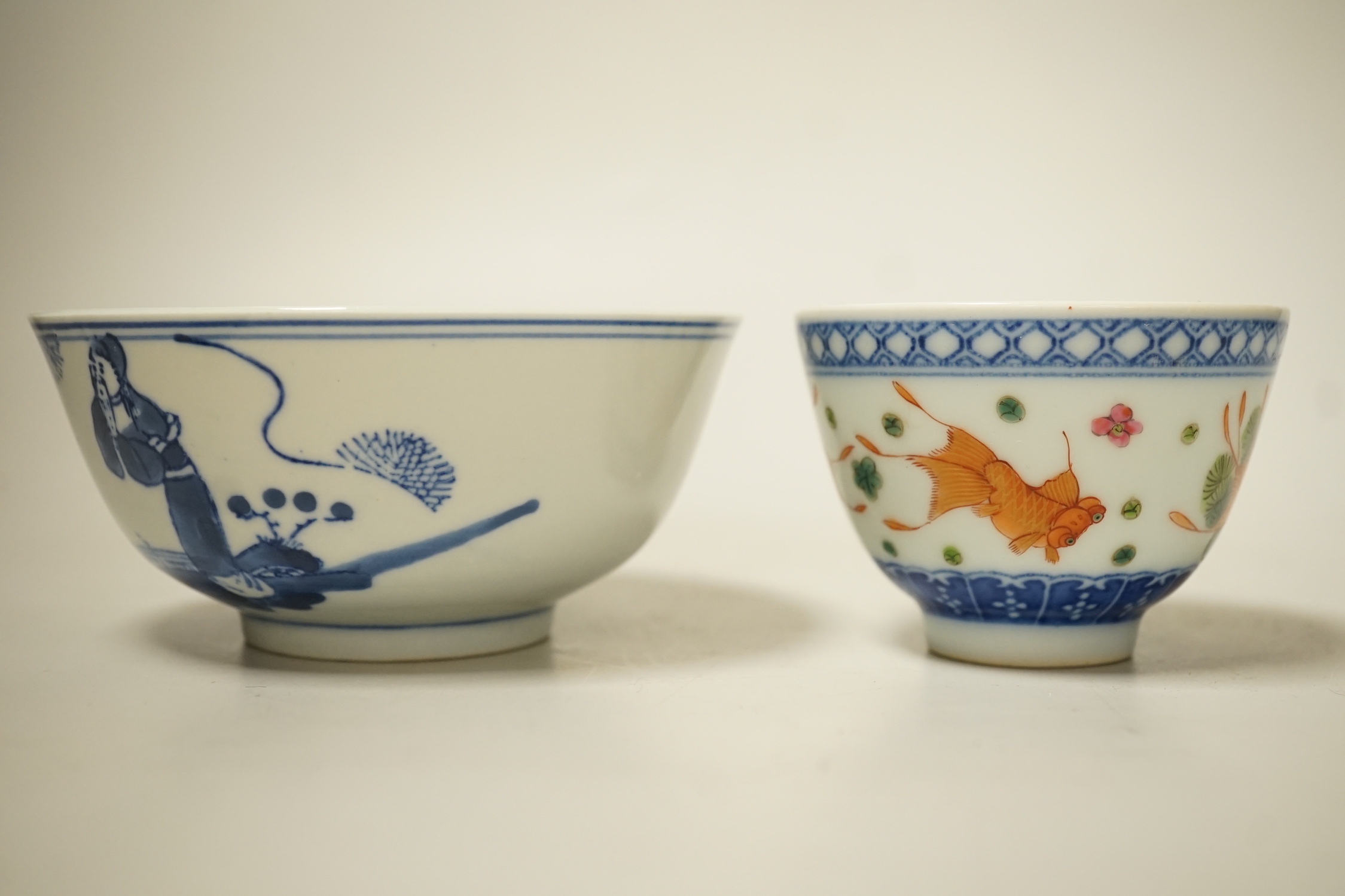 A 19th century Chinese blue and white bowl, an enamelled goldfish cup and two snuff bottles